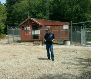 Mike G. holding his drone after taking a video of the tower on Bennett Hill